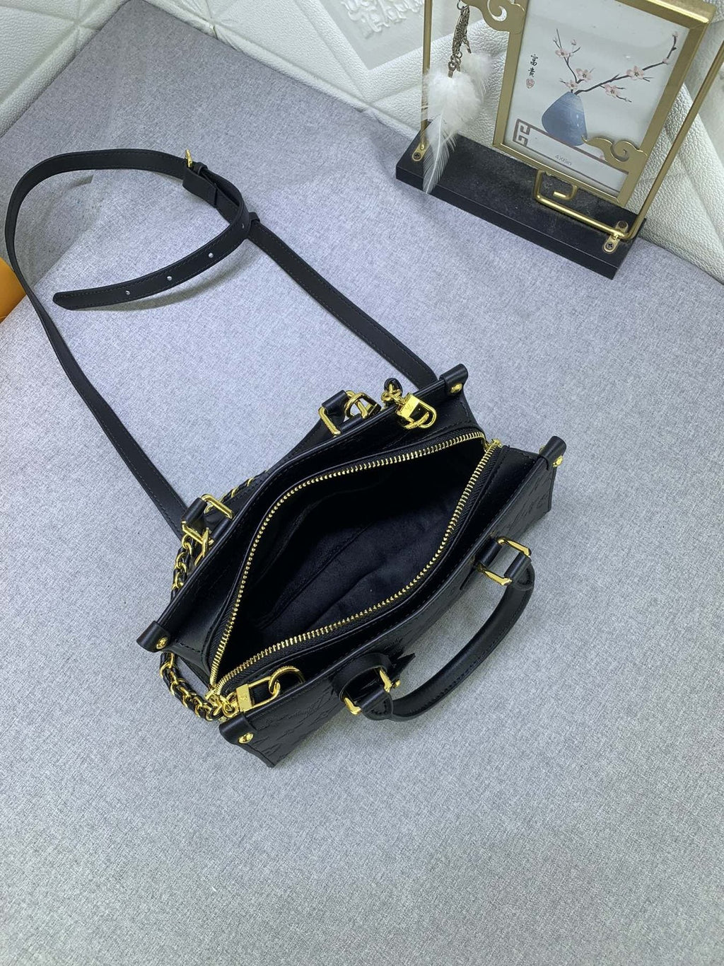 Louis Vuitton OnTheGo East West Embossed Leather Handbag — detail