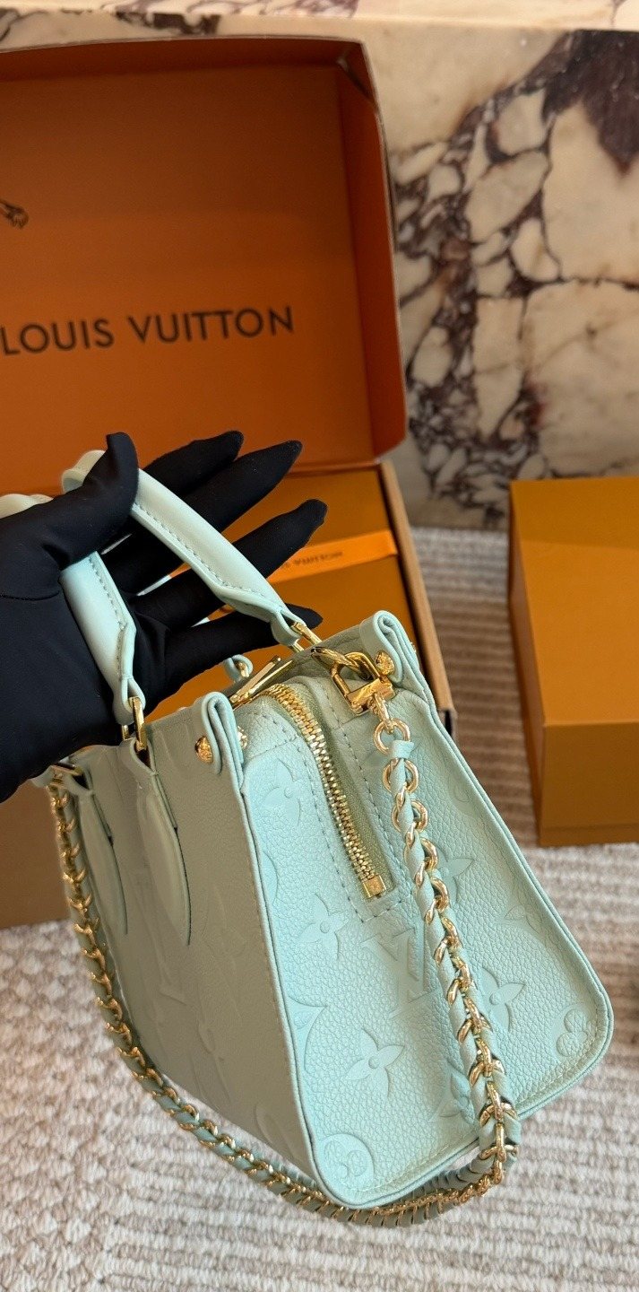 Louis Vuitton Onthego Mint Green Embossed Handbag — side