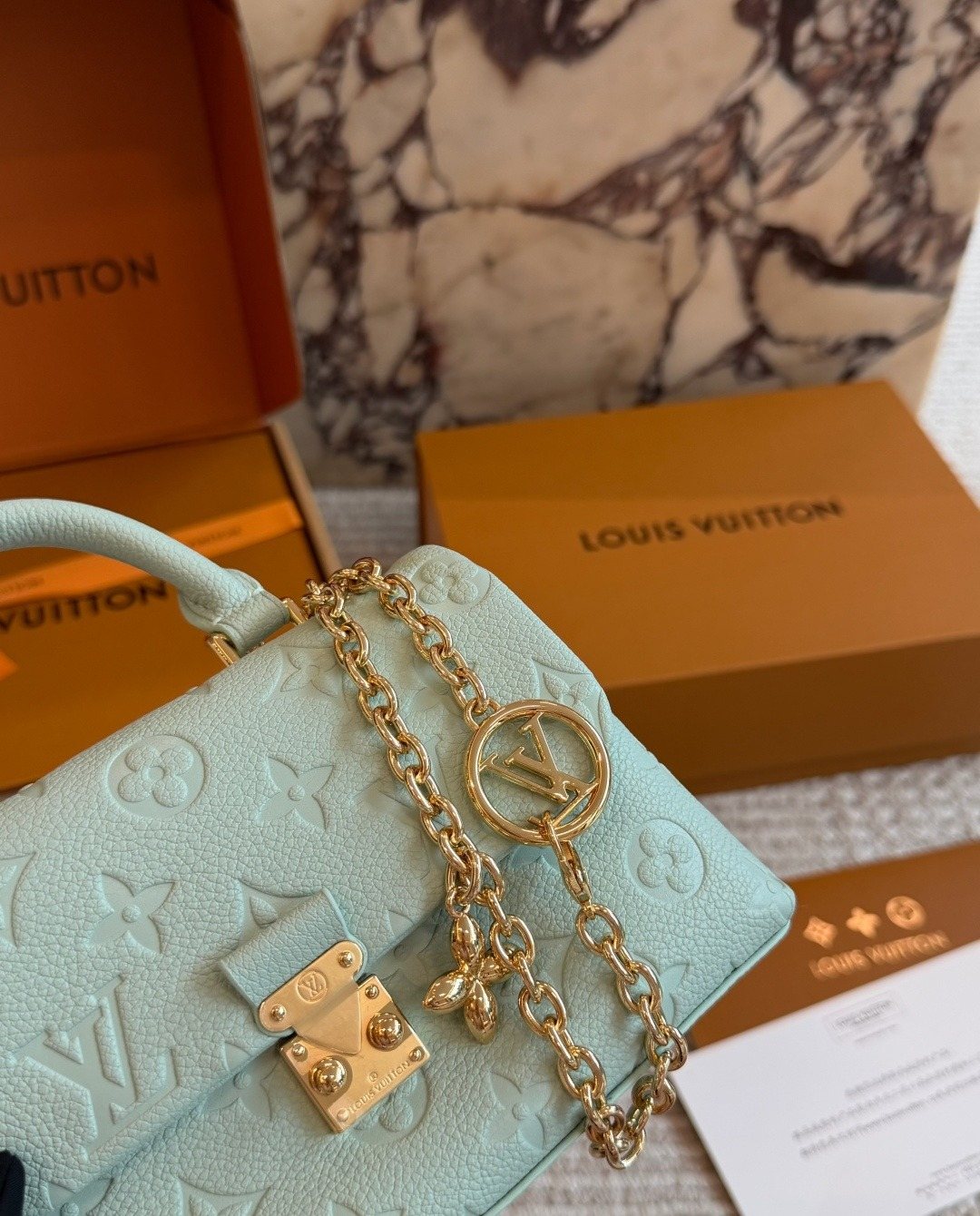 Louis Vuitton Nano Madeleine Monogram Empreinte Top-Handle Bag — detail