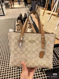 Coach Patterned Tote Bag with Tan Buckle Handles — hero