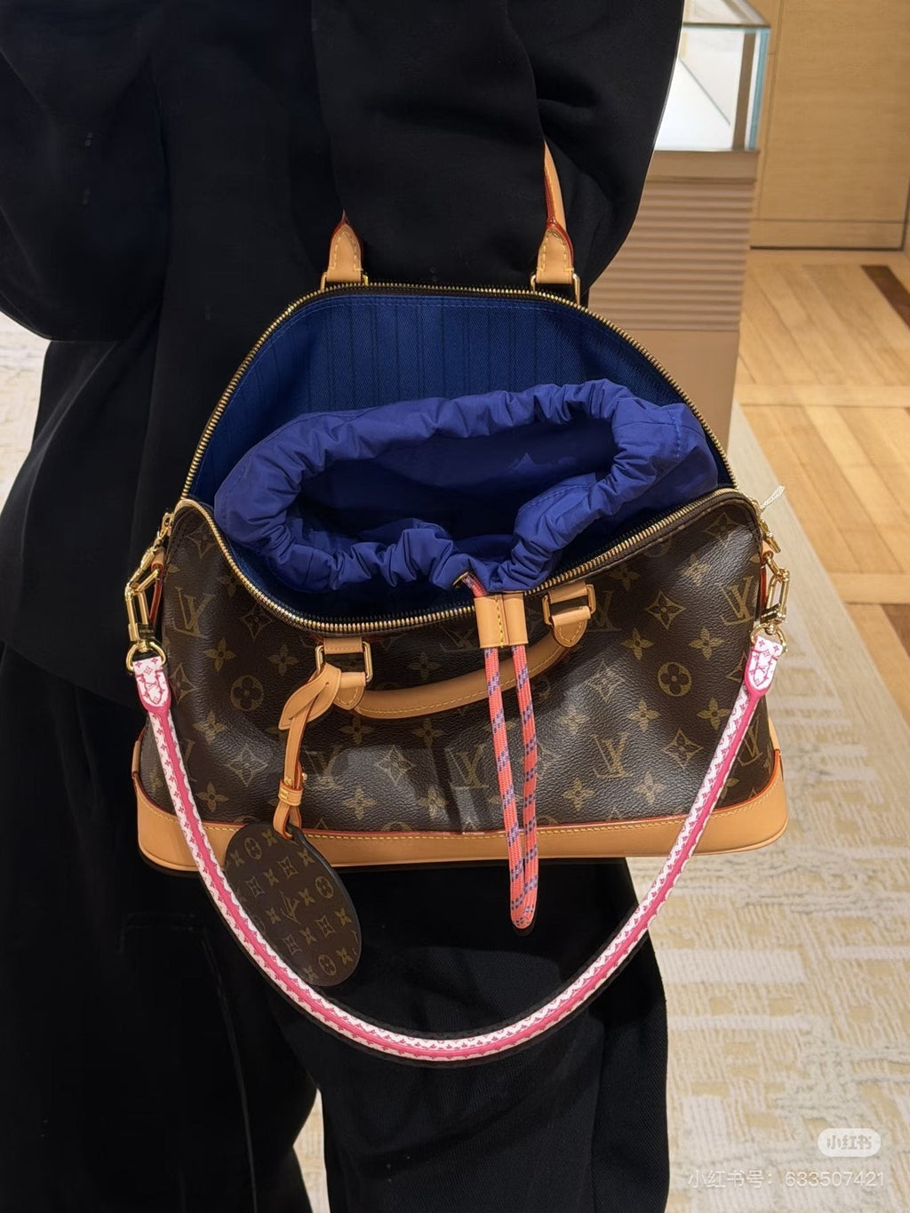 Louis Vuitton Alma Monogram Handbag with Pink Strap — model