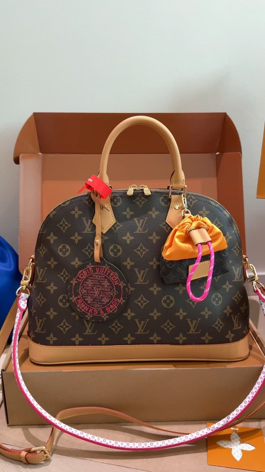 Louis Vuitton Alma Monogram Handbag with Pink Strap — hero