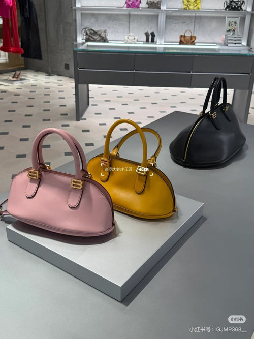 Balenciaga Bolero Rounded Bowling Bag — comparison