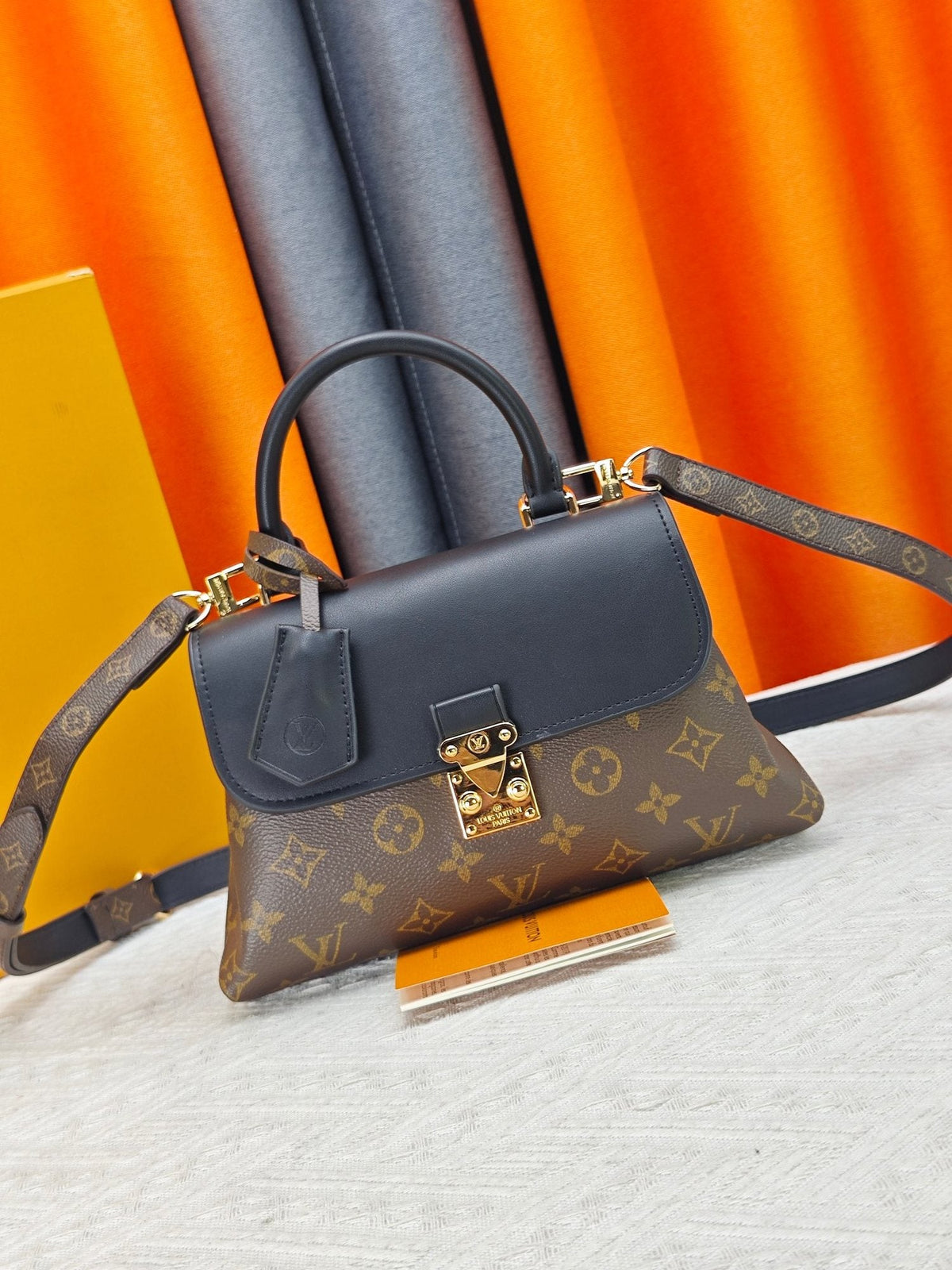 Louis Vuitton Madeleine BB Monogram Top-Handle Bag — hero