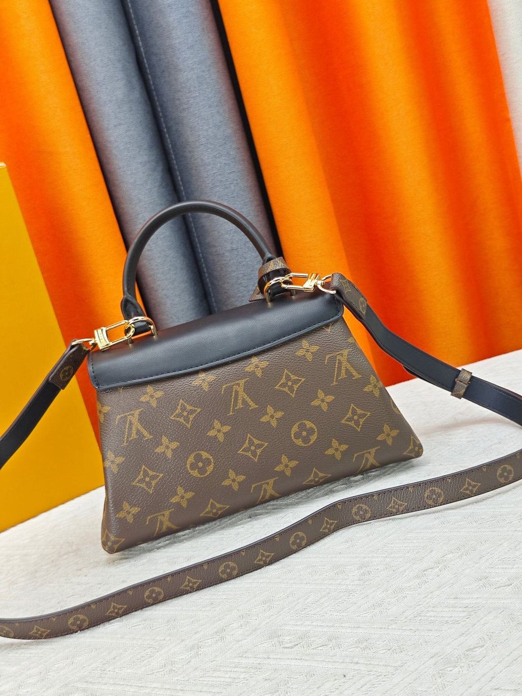 Louis Vuitton Madeleine BB Monogram Top-Handle Bag — back