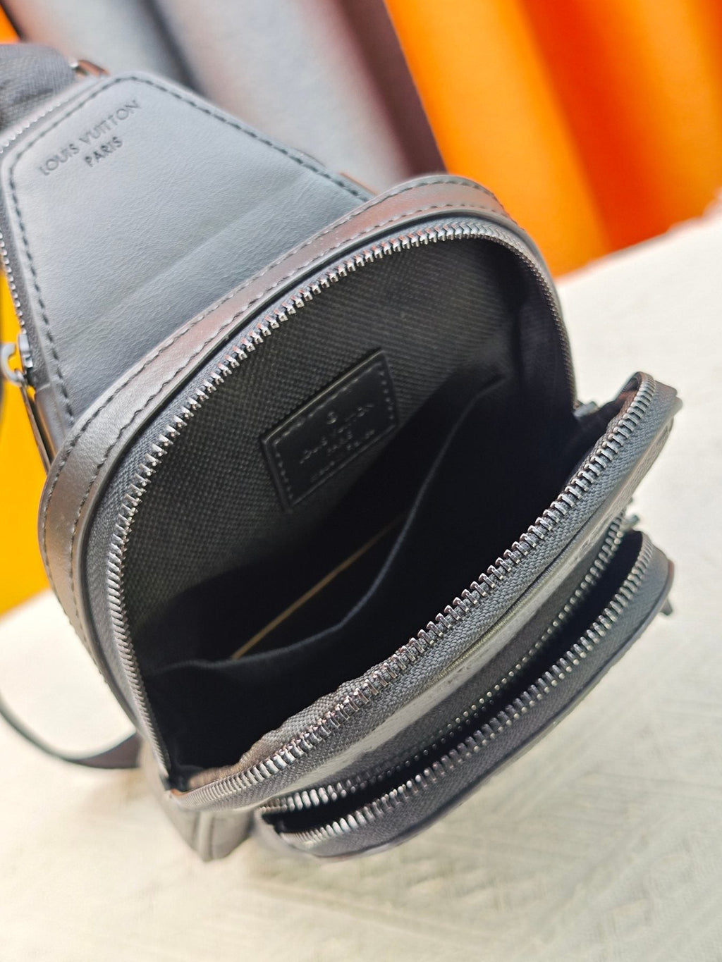 Louis Vuitton Avenue Sling Bag PM in Embossed Monogram — detail
