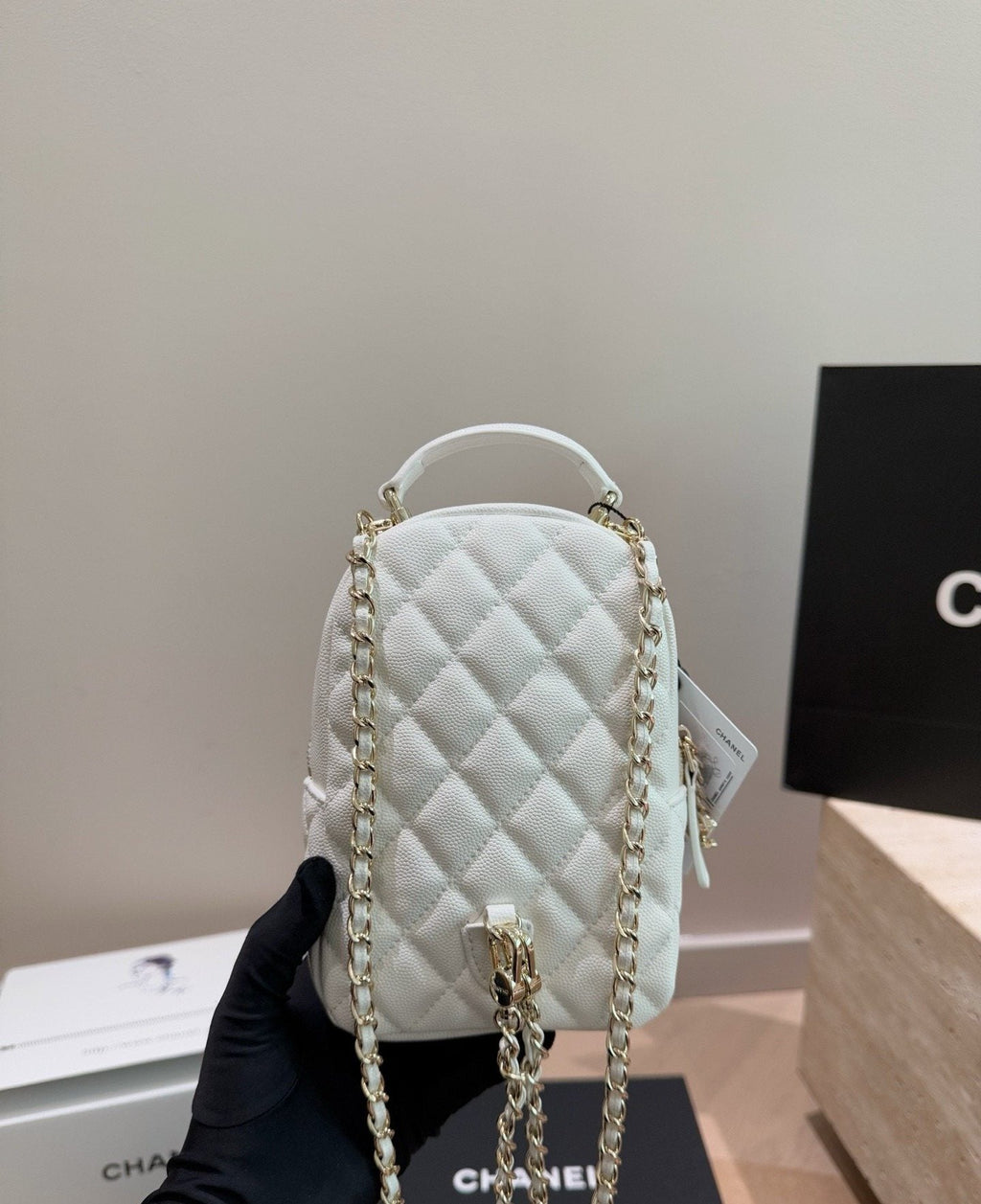 Chanel Quilted Top-Handle Backpack — side