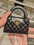 Chanel Kelly Quilted Top-Handle Bag — hero