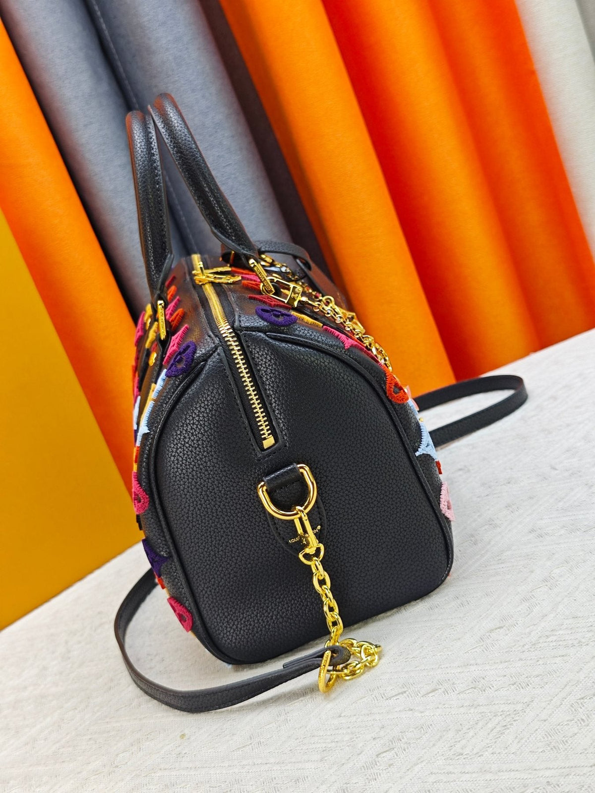 Louis Vuitton Speedy Bandoulière Printed Leather Bag — side