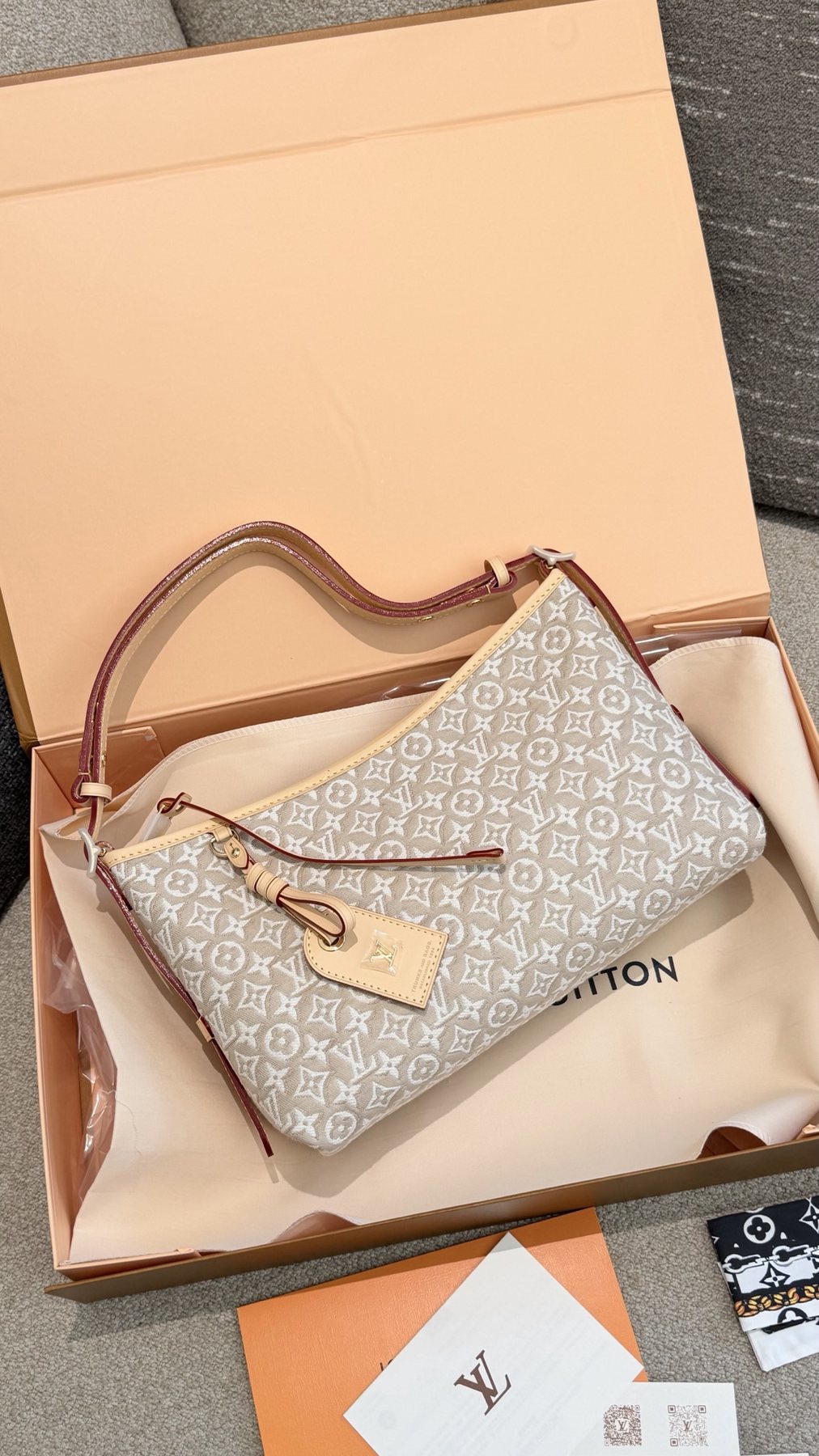 Louis Vuitton Carryall East West Raised Monogram Shoulder Bag — front