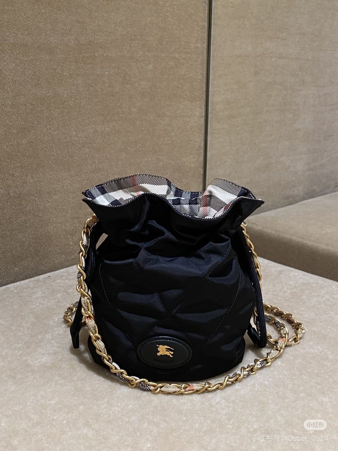 Black Quilted Chain-Strap Bucket Bag — detail