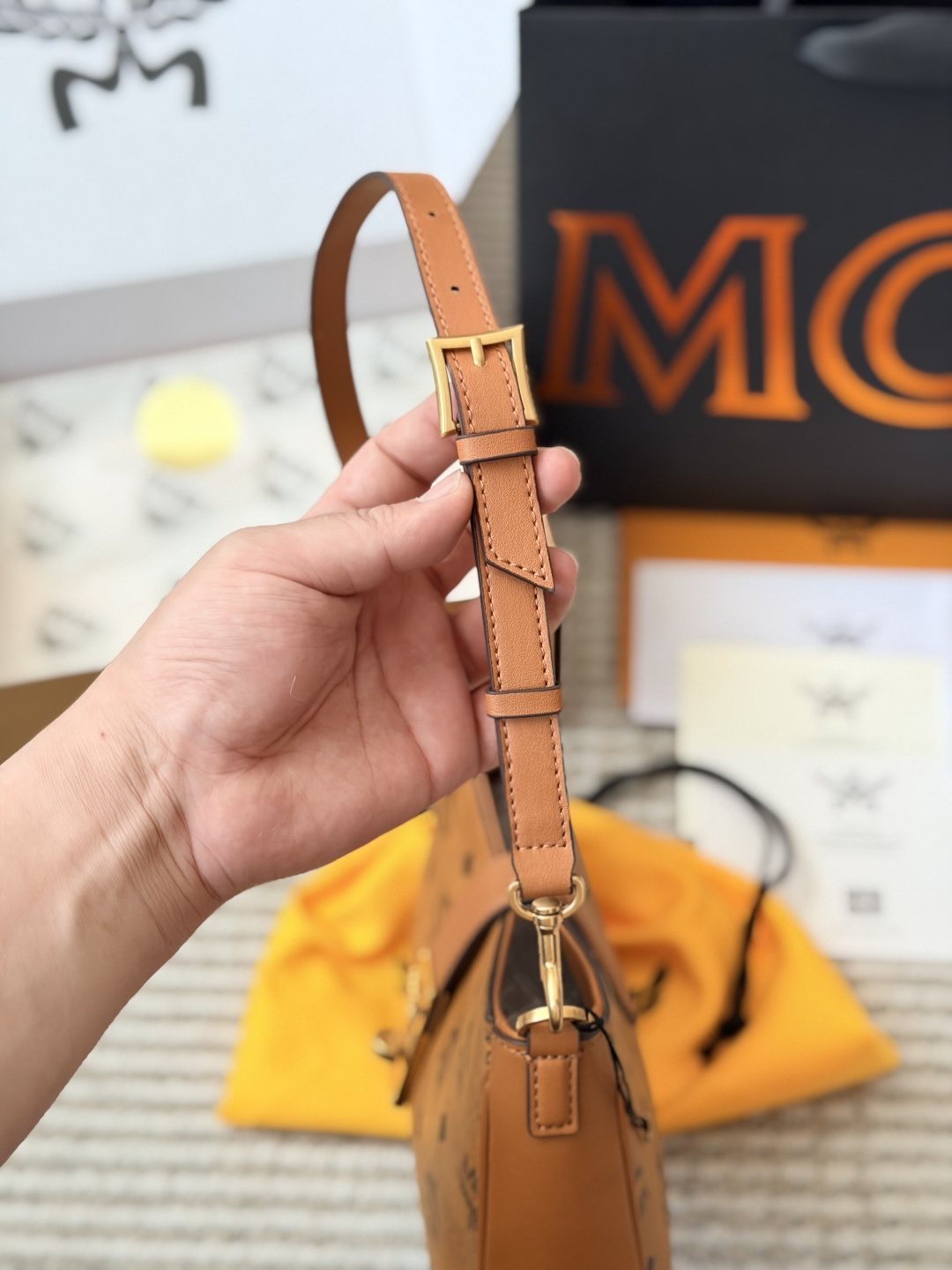 MCM Monogram Hobo Bag with Gold-Tone Clasp — front