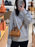 MCM Boston Printed Satchel Bag — model