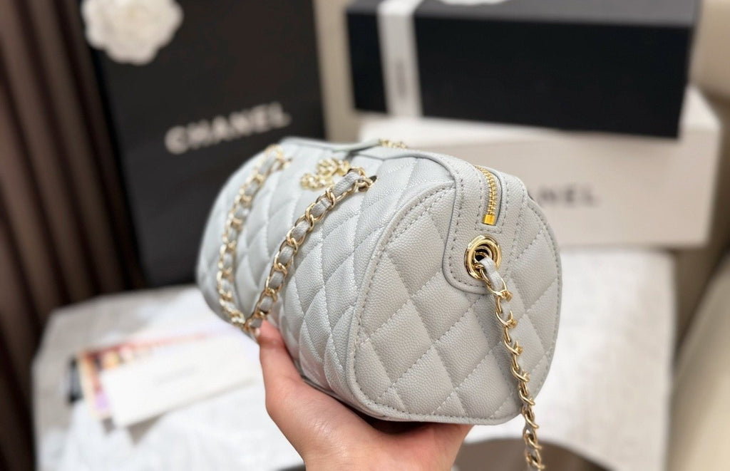 Chanel Quilted Bowling Bag with Jeweled CC Emblem — side