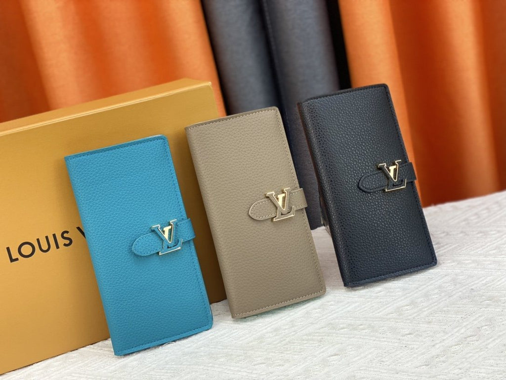 Louis Vuitton Vertical Grained Leather Wallet — comparison