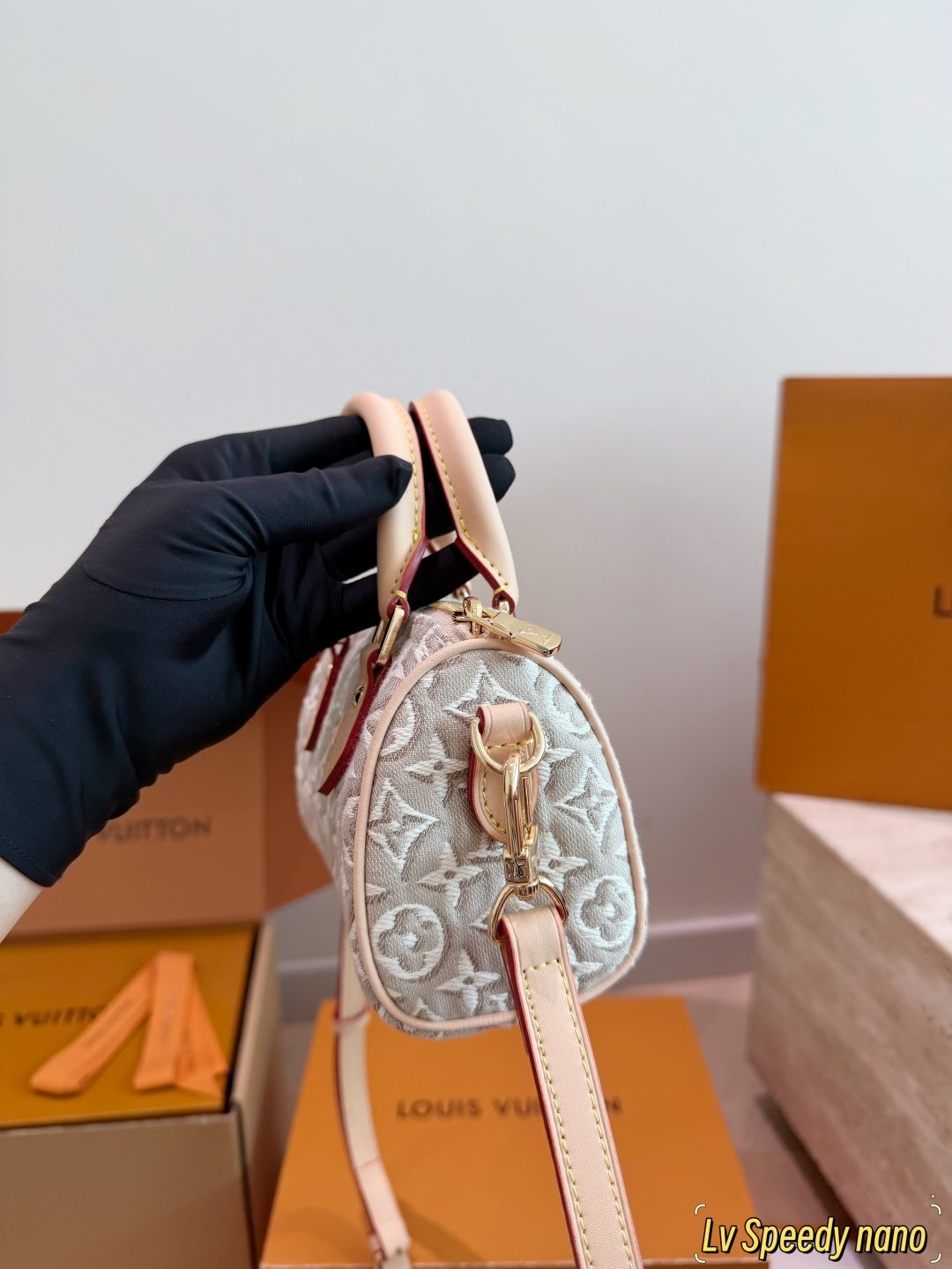 Louis Vuitton Raised Monogram Rounded Satchel — side
